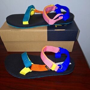 A pair of Teva Original Universal sandals with multicolored straps. NWT